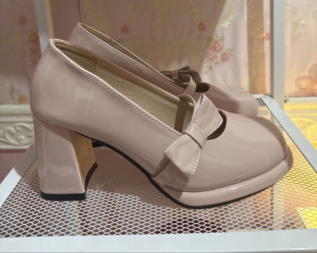 Pink Patent Mary Jane Platform Heels with Bow (Category: Heels) located in Bacoor. Submitted by micsr (Listing ID 1469896042, Image 3). Description: Size 36 Glossy pink patent leather platform heels. Chunky block heels with a shiny finish. Cute bow detail on the strap across the instep. Rounded square toe style. Neutral blush shade goes with lots of outfits. With minimal flaw as seen in the photo..