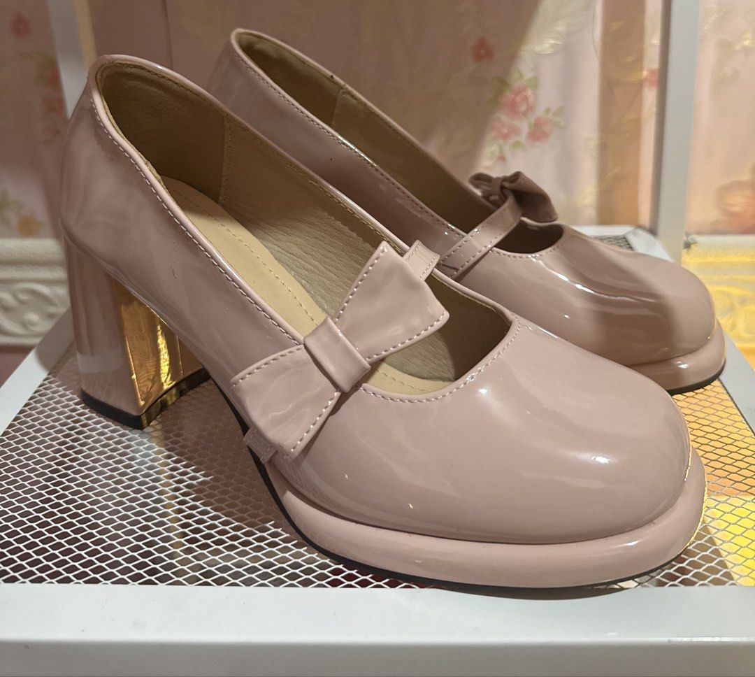 Pink Patent Mary Jane Platform Heels with Bow (Category: Heels) located in Bacoor. Submitted by micsr (Listing ID 1469896042, Image 2). Description: Size 36 Glossy pink patent leather platform heels. Chunky block heels with a shiny finish. Cute bow detail on the strap across the instep. Rounded square toe style. Neutral blush shade goes with lots of outfits. With minimal flaw as seen in the photo..