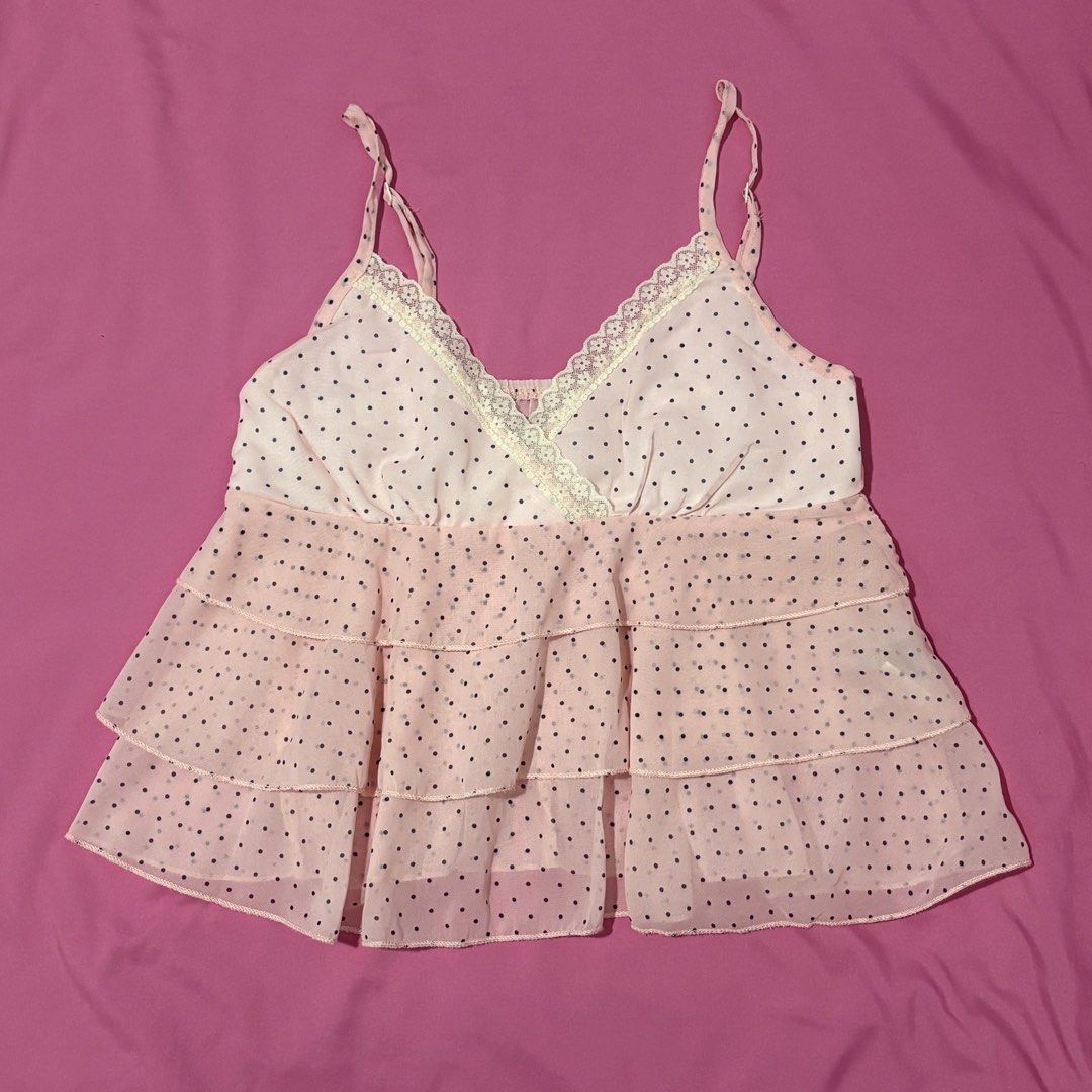 Pink polka dot cami top with ruffled layers (Category: Sleeveless) located in Quezon City. Submitted by luna_ily (Listing ID 1469927831, Image 1). Description: 🍒 Send a message for more pictures (such as when worn) and inquiries. Location: Cubao, Quezon City Mode of delivery: J&T and Lalamove (shipping fee will be shouldered by the buyer) Mode of payment: GCash, Maya, GoTyme .