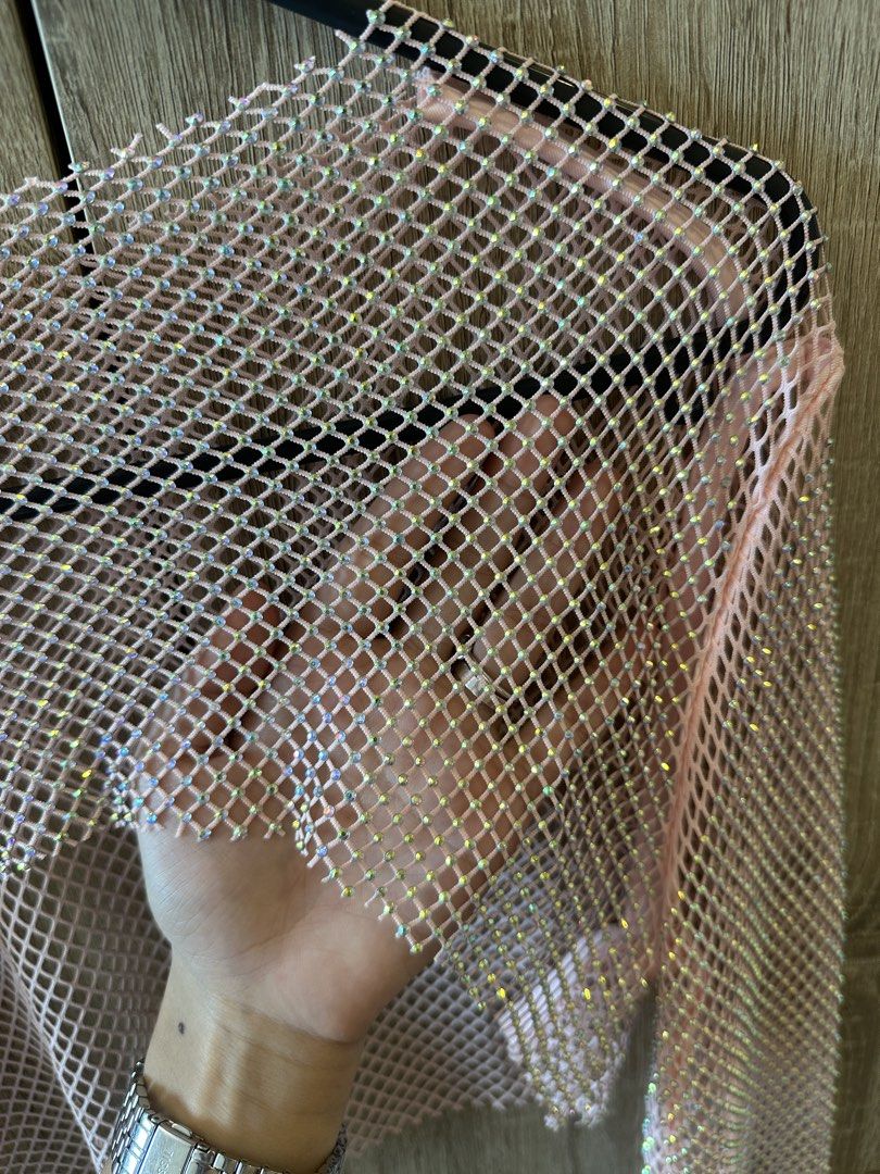 Pink Rhinestone Fishnet Long Sleeve Crop Top (Category: Longsleeves) located in Pateros City. Submitted by overandout. (Listing ID 1469846089, Image 2). Description: - Color: Sparkly pink - Material: Lightweight, stretchy sheer mesh fishnet - Design: All-over tiny rhinestones with long sleeves and crop top fit - Versatility: Great layering piece for festivals, concerts, and night outs - Condition: Brand new / Excellent.