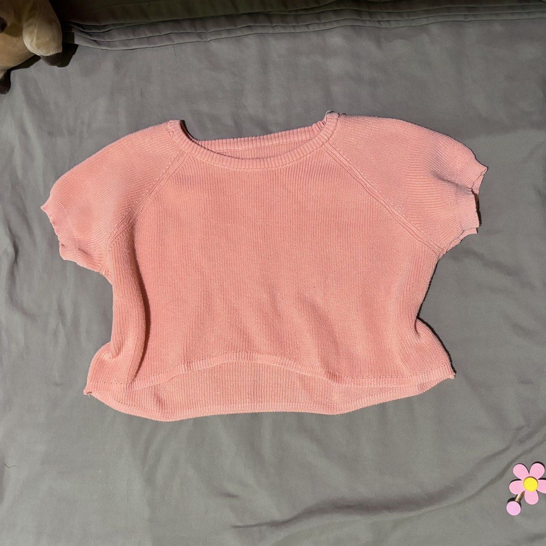 Pink Short Sleeve Knit Crop Top (Category: Shirts) located in Manila. Submitted by shimiiiiiii (Listing ID 1469799226, Image 1). Description: - Color: Soft pink - Material: Ribbed knit texture - Design: Rounded neckline and short cap sleeves - Fit: Cropped length with a slightly curved hemline - Style: Versatile casual staple, perfect for pairing with high-waisted jeans or skirts.