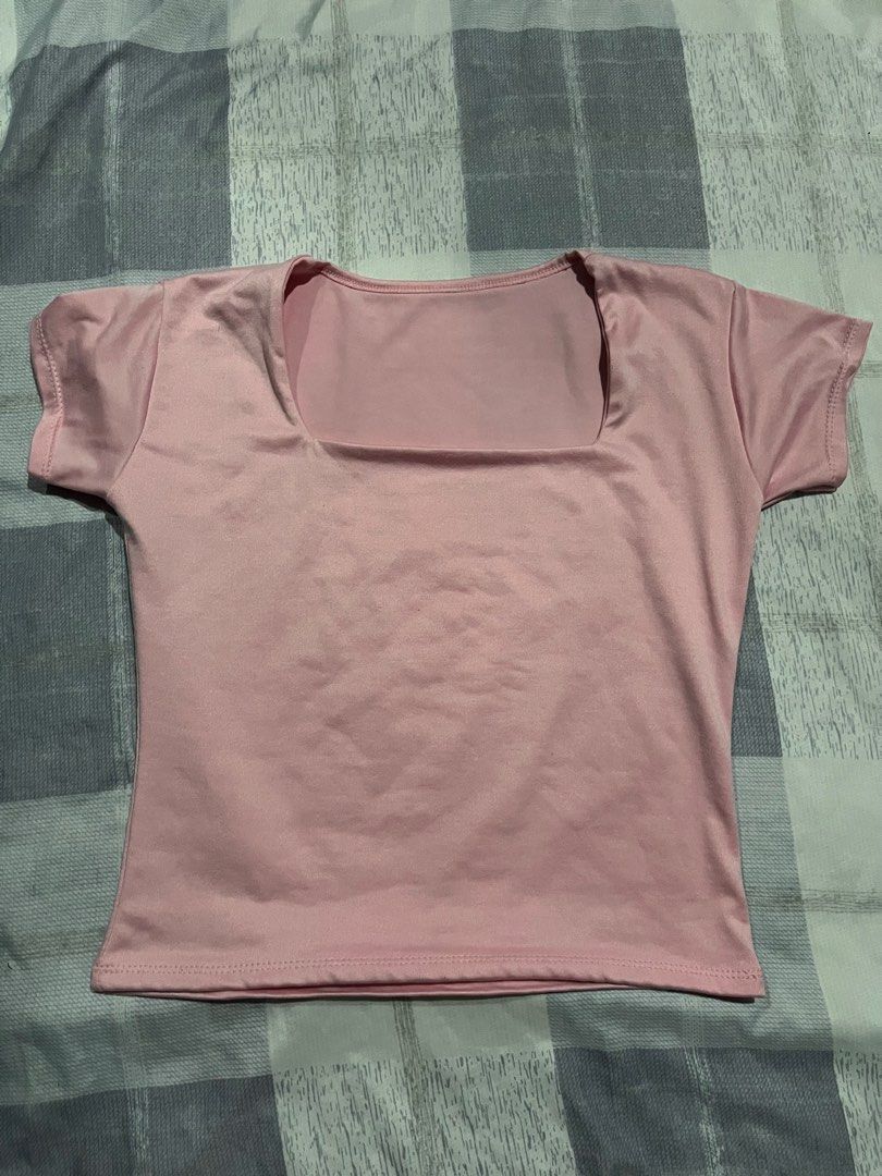 Pink Square Neck Crop Top Short Sleeve (Category: Shirts) located in Legazpi City. Submitted by chynnunez (Listing ID 1469877649, Image 1). Description: - Color: Light pink - Style: Fitted short-sleeve crop top - Neckline: Wide square neckline - Fabric: Smooth and stretchy - Fit: Body-hugging - Condition: Clean and well-kept - Perfect for pairing with high-waisted bottoms.