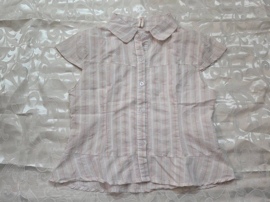 Pink Striped Short Sleeve Button-Down Blouse (Category: Blouses) located in Manila. Submitted by drieinpink31 (Listing ID 1469838924, Image 1). Description: - Color: Pink and white vertical stripes - Design: Short sleeves, rounded collar, and playful ruffled hem - Closure: Front button-down with white buttons - Fit: Regular fit, lightweight and comfortable fabric - Styling: Perfect for casual daily wear, school, or office OOTDs - Condition: Excel