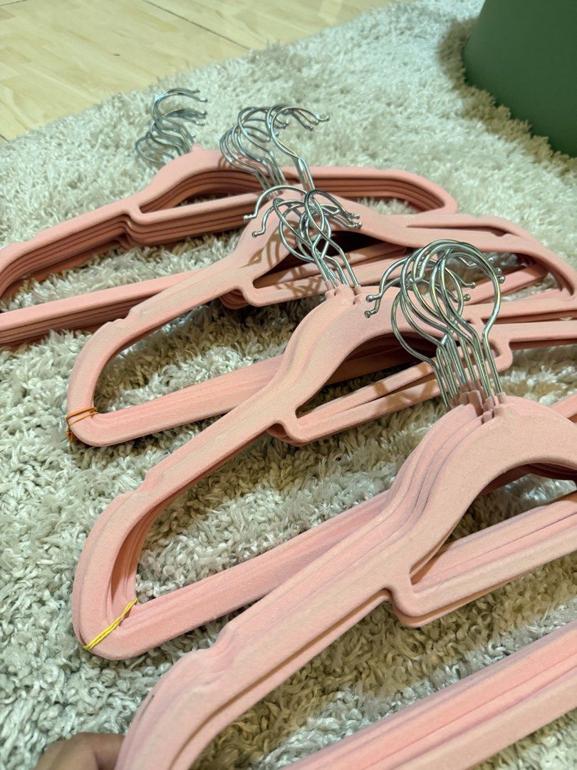 Pink Velvet Clothes Hangers (Category: Hooks & Hangers) located in Mandaluyong City. Submitted by riz_040521 (Listing ID 1469795727, Image 3). Description: - Color: Chic pink - Material: Soft velvet-textured coating - Hook: 360-degree swiveling metal hook - Non-slip design prevents clothes from falling - Space-saving profile to tidy up your wardrobe - Comes conveniently stacked and bundled with rubber bands -25 pieces for 250 pesos.