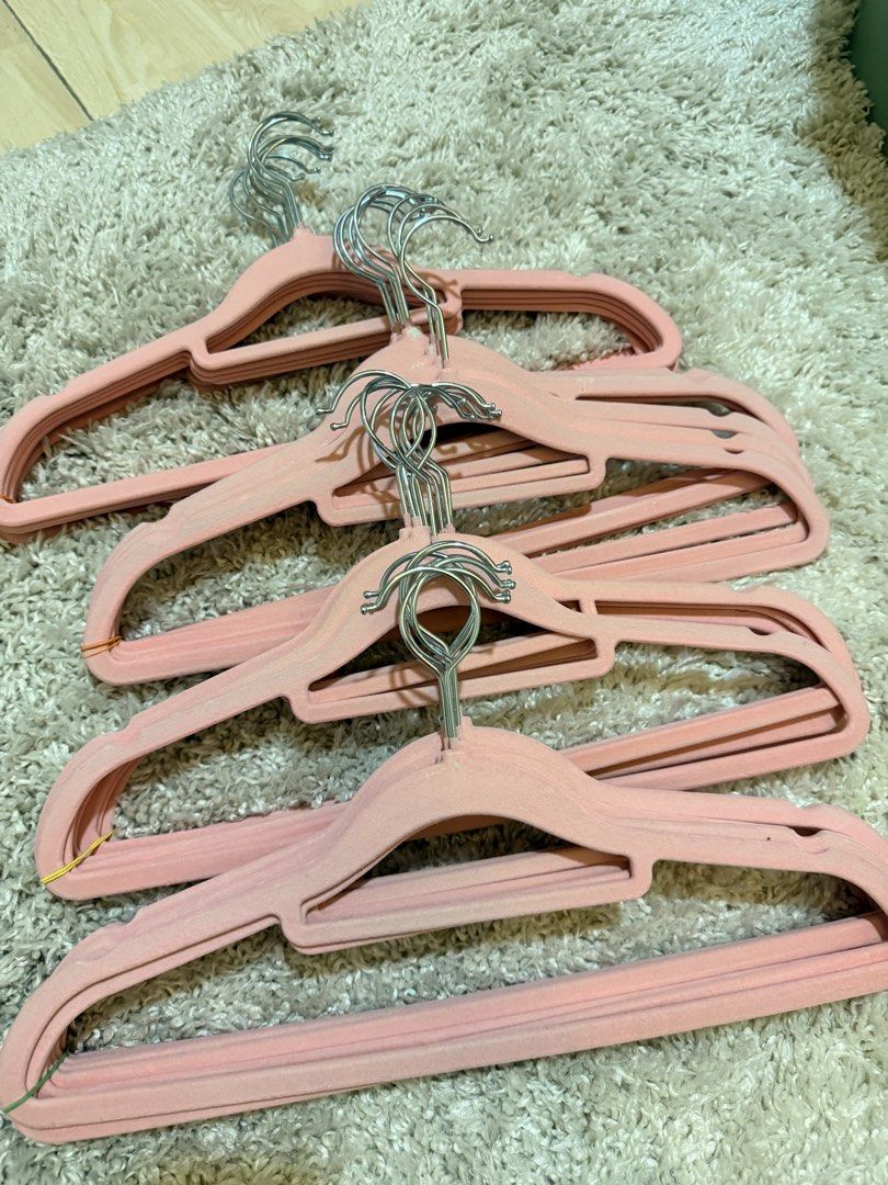 Pink Velvet Clothes Hangers (Category: Hooks & Hangers) located in Mandaluyong City. Submitted by riz_040521 (Listing ID 1469795727, Image 2). Description: - Color: Chic pink - Material: Soft velvet-textured coating - Hook: 360-degree swiveling metal hook - Non-slip design prevents clothes from falling - Space-saving profile to tidy up your wardrobe - Comes conveniently stacked and bundled with rubber bands -25 pieces for 250 pesos.