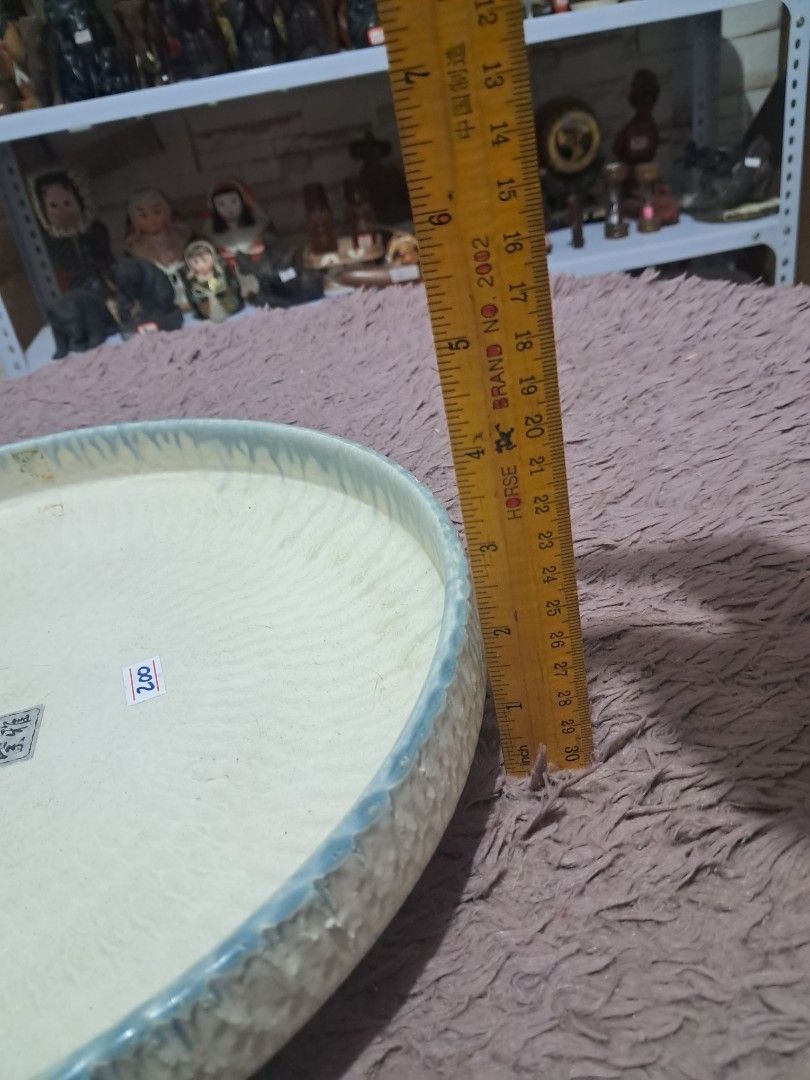 Platter (Category: Food Organization & Storage) located in Cavite. Submitted by secretjapansurplus (Listing ID 1469894470, Image 3). Description: Up for sale is a beautiful, authentic Japanese ceramic platter featuring a stunning textured radial design and an elegant dripped glazed rim. This versatile piece is perfect as a decorative display, a unique serving platter, or a traditional Ikebana flower arrangement shallow vase. Condition: • Brand Ne