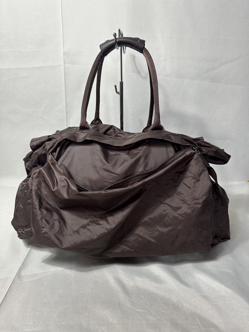 Pleats Please Issey Miyake Transformable Boston Bag (Category: Sling Bags) located in Cabanglasan. Submitted by thefashiongarage.co (Listing ID 1469765244, Image 3). Description: Title - Pleats Please x Issey Miyake Model/Name - Tranformable 2 Way Boston Bag Size on Tag - Large Conditiion - Excellent as new with no issue Dimension (WxLxH) - 18x13 Inches Category- Travel/ Duffle/ Casual Bag Fitting - Made in - Japan Material - Nylon/ Leather Color