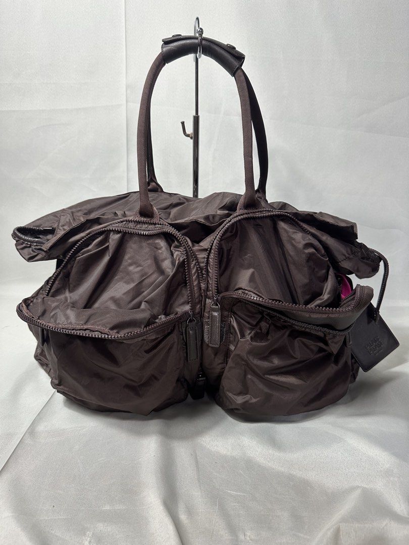 Pleats Please Issey Miyake Transformable Boston Bag (Category: Sling Bags) located in Cabanglasan. Submitted by thefashiongarage.co (Listing ID 1469765244, Image 2). Description: Title - Pleats Please x Issey Miyake Model/Name - Tranformable 2 Way Boston Bag Size on Tag - Large Conditiion - Excellent as new with no issue Dimension (WxLxH) - 18x13 Inches Category- Travel/ Duffle/ Casual Bag Fitting - Made in - Japan Material - Nylon/ Leather Color