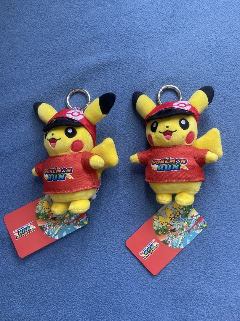 Pokemon Run Pikachu Plush Keychain with Tag (Category: Plushies & Soft Toys) located in Manila. Submitted by nomadicmark (Listing ID 1469763343, Image 1). Description: - Official Pokémon Run merchandise with original tags attached - Design: Bright yellow Pikachu wearing a matching red shirt and Pokeball logo cap - Hardware: Durable metal ring securely attached for keys or bags - Condition: Brand new and pristine - Purchase Options: Available indi