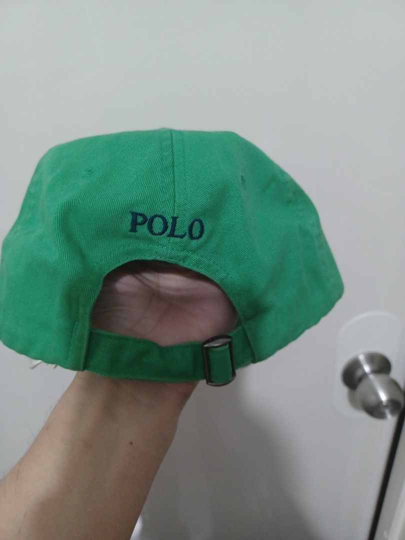 Polo Ralph Lauren Green Baseball Cap (Category: Caps & Hats) located in Mandaluyong City. Submitted by usamenfashionhaul (Listing ID 1469918184, Image 2). Description: Green baseball cap from Polo Ralph Lauren. green embroidered pony logo on the front. Matching blue POLO embroidery above the back strap. Adjustable metal slider closure on the back strap. Clean green cotton twill fabric..