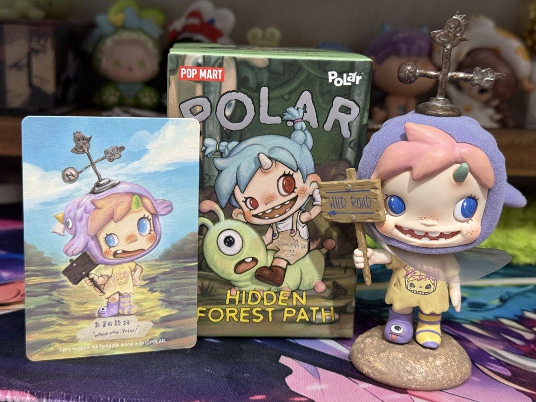 Pop Mart Polar Hidden Forest Path Figure and Card (Category: Designer & Blind Box Toys) located in Calamba. Submitted by blissblixi12029 (Listing ID 1469878136, Image 1). Description: - Item: Pop Mart Polar Hidden Forest Path blind box figure - Character: Purple hooded character holding a Wild Road sign - Inclusions: Matching character card and original box - Condition: Opened just to check the design, figure and card are clean - Perfect for Pop 