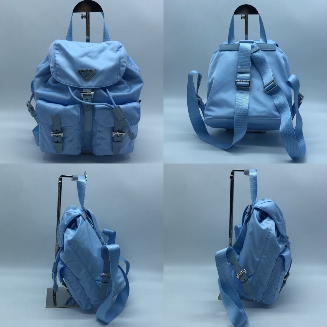 PRADA BAG NYLON BACKPACK LIGHT BLUE (Category: Luxury Bags & Wallets) located in Taguig. Submitted by ecoring.ph (Listing ID 1469805195, Image 2). Description: ◆CONDITION: AB ◆DESCRIPTIONS: (Other defects/info:) OUTER: The body of the bag has very minimal stains. HARDWARE: The hardware of the bag has minor scratches. The overall condition of the bag remains good and almost new. ◆SIZE: ⁎WIDTH: 24cm. (approximately only) *HEIGHT: 20cm. (approximate