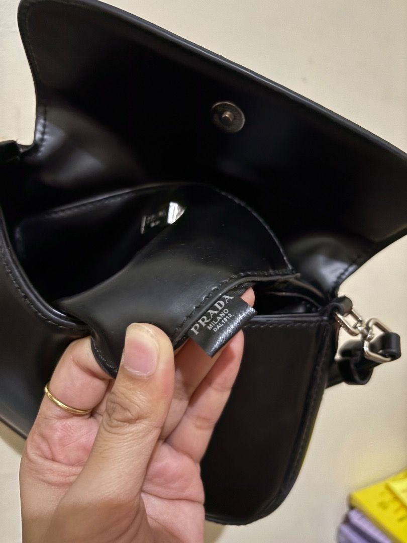 Prada Black Leather Shoulder Bag (Category: Luxury Bags & Wallets) located in Caloocan City. Submitted by freeriver-79bd71 (Listing ID 1469892619, Image 3). Description: - Authentic Prada black leather shoulder bag - Classic flap closure with sleek silver hardware - Iconic triangular Prada logo on the front - Smooth leather finish with a clean structure - Comfortable adjustable strap - Prada logo tag inside the clean interior - Timeless design th
