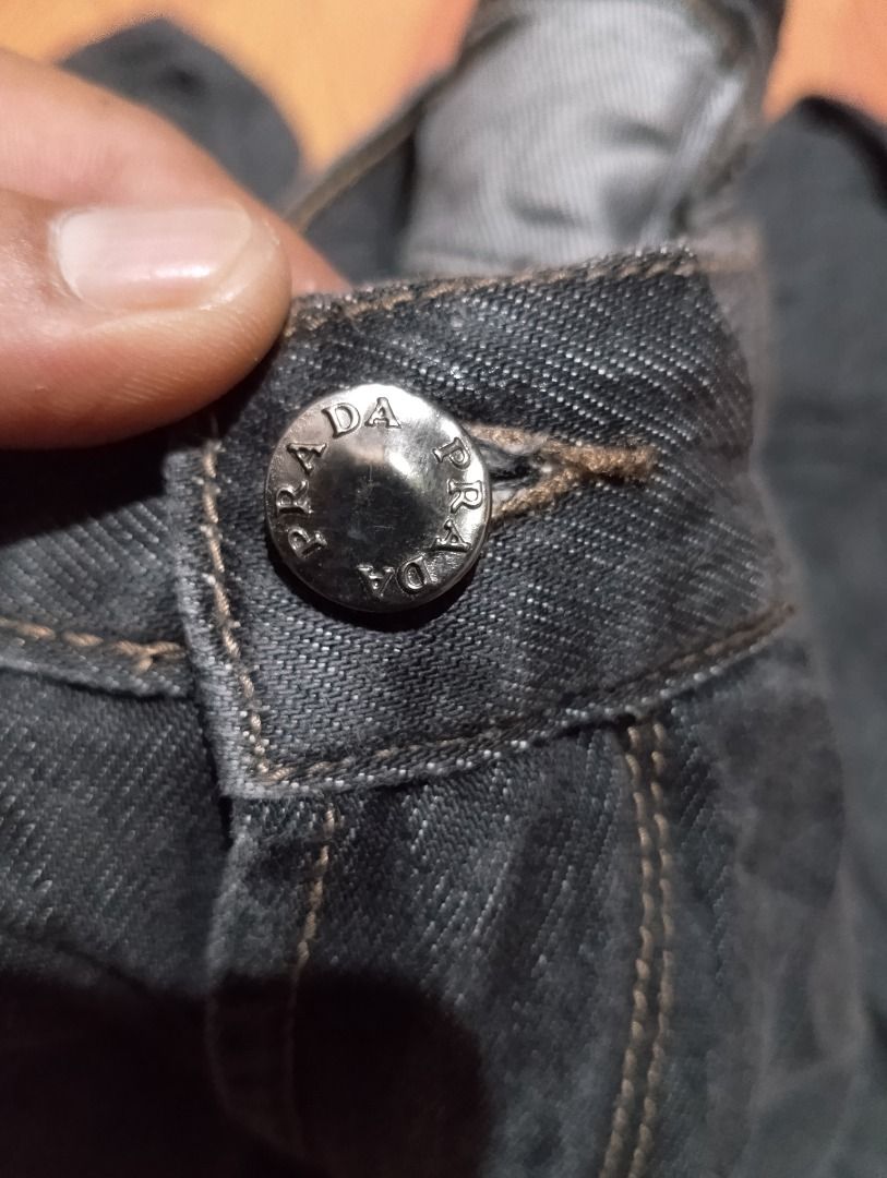 Prada Dark Grey Indigo Denim Jeans Size 32-34 (Category: Jeans) located in Cavite. Submitted by marvzclothing (Listing ID 1469893099, Image 3). Description: - Brand: Prada - Color: Dark Grey (Pure Indigo Denim) - Size: Tagged Size 32-34 - Fit: Regular Fit - Material: 98% Cotton, 2% Other Fibers - Hardware: Branded button and YKK zipper fly - Origin: Made in Romania - Condition: Great quality casual jeans designed to age beautifully with natural f
