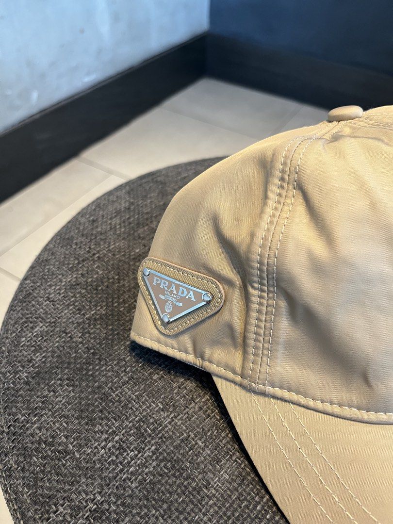 PRADA KHAKI SIDE PATCH LOGO (Category: Hats & Beanies) located in Quezon City. Submitted by headline. (Listing ID 1469827328, Image 2). Description: PRADA SIDE LOGO KHAKI NYLON EXCELLENT CONDITION FOR ONLY:1,250php +SHIPPING FEE.