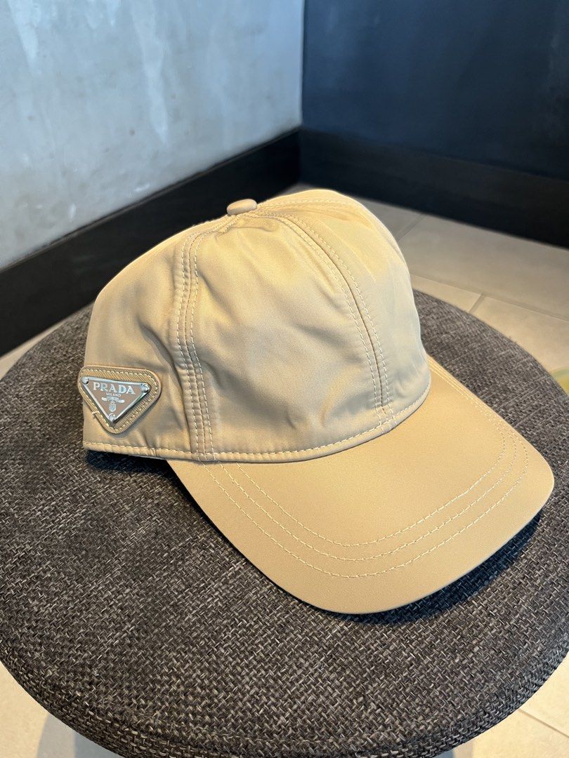PRADA KHAKI SIDE PATCH LOGO (Category: Hats & Beanies) located in Quezon City. Submitted by headline. (Listing ID 1469827328, Image 1). Description: PRADA SIDE LOGO KHAKI NYLON EXCELLENT CONDITION FOR ONLY:1,250php +SHIPPING FEE.