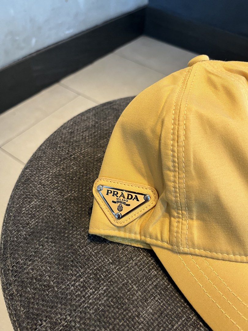 PRADA MUSTARD YELLOW NYLON (Category: Hats & Beanies) located in Quezon City. Submitted by headline. (Listing ID 1469827632, Image 2). Description: PRADA SIDE LOGO MUSTARD YELLOW VELCRO EXCELLENT CONDITION FOR ONLY:1,250php +SHIPPING FEE.