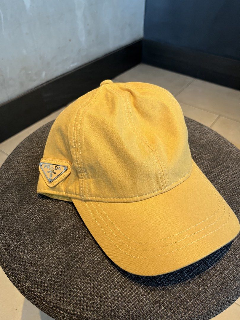 PRADA MUSTARD YELLOW NYLON (Category: Hats & Beanies) located in Quezon City. Submitted by headline. (Listing ID 1469827632, Image 1). Description: PRADA SIDE LOGO MUSTARD YELLOW VELCRO EXCELLENT CONDITION FOR ONLY:1,250php +SHIPPING FEE.