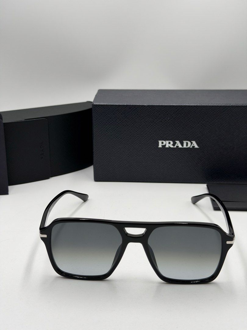 Prada PR 20YS (Color Code: 1AB06T) men's navigator sunglasses. (Category: Luxury Accessories) located in Lipa City. Submitted by _cmluxephilippines (Listing ID 1469772707, Image 2). Description: Prada PR 20YS (Color Code: 1AB06T) men’s navigator sunglasses. .Frame Style: Modern architectural pilot/navigator shape made from premium black acetate .Lens Details: Non-polarized grey gradient crystal lenses that provide complete UV protection. .Hardwar