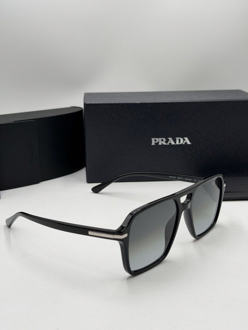 Prada PR 20YS (Color Code: 1AB06T) men's navigator sunglasses. (Category: Luxury Accessories) located in Lipa City. Submitted by _cmluxephilippines (Listing ID 1469772707, Image 3). Description: Prada PR 20YS (Color Code: 1AB06T) men’s navigator sunglasses. .Frame Style: Modern architectural pilot/navigator shape made from premium black acetate .Lens Details: Non-polarized grey gradient crystal lenses that provide complete UV protection. .Hardwar