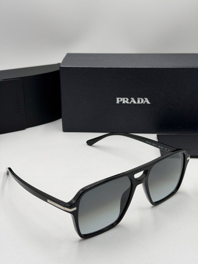 Prada PR 20YS (Color Code: 1AB06T) men's navigator sunglasses. (Category: Luxury Accessories) located in Lipa City. Submitted by _cmluxephilippines (Listing ID 1469772707, Image 1). Description: Prada PR 20YS (Color Code: 1AB06T) men’s navigator sunglasses. .Frame Style: Modern architectural pilot/navigator shape made from premium black acetate .Lens Details: Non-polarized grey gradient crystal lenses that provide complete UV protection. .Hardwar
