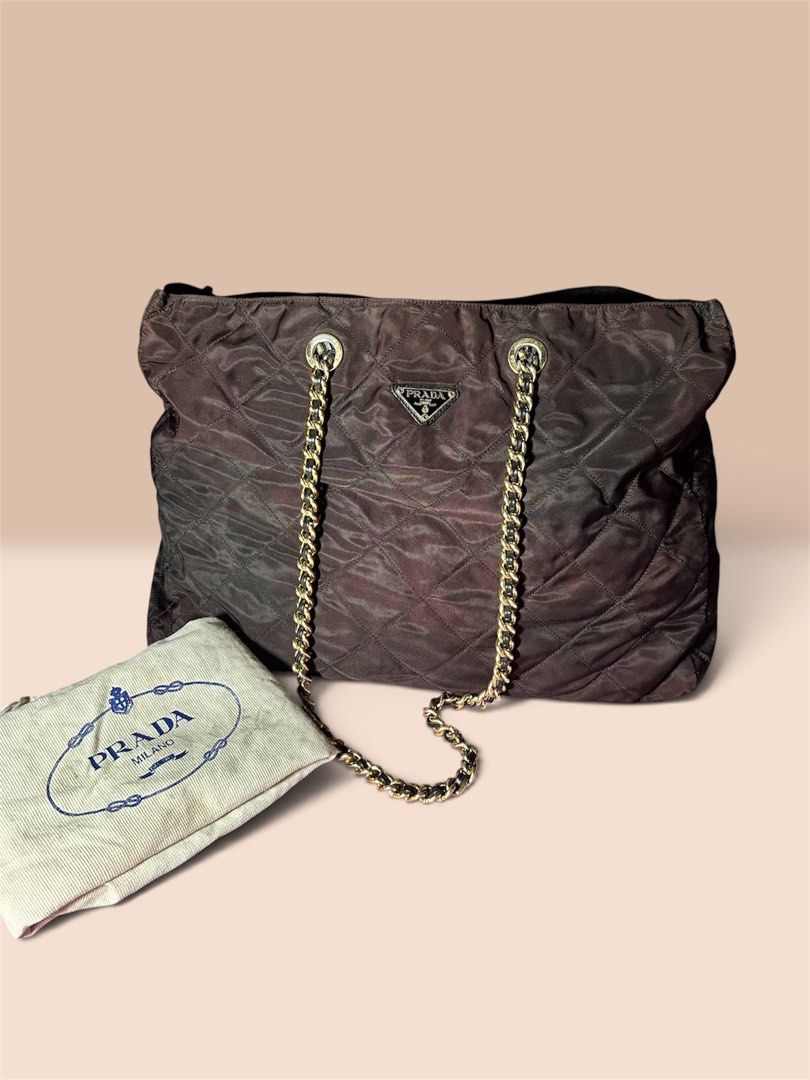 PRADA Rare Large Catena Chain Tote (Category: Luxury Bags & Wallets) located in Cagayan de Oro. Submitted by kjcartier26 (Listing ID 1469921720, Image 1). Description: Rare Prada. Vintage 3 C’s Puller - Large tote Bag. - In good condition. - With Dustbag Inclusion. - Good nylon, Clean stiches, No holes. - Good corners, zipper, And Magnetic closure. - Minimal faded chain, but no major flaws. - The color of the bag As is, I can’t find it somewhere 