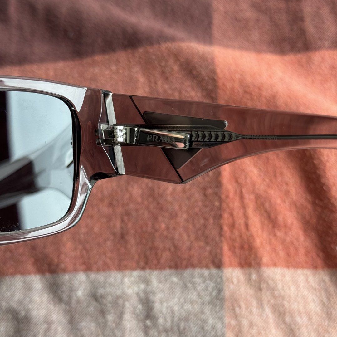 Prada Sunglasses (Category: Sunglasses & Eyewear) located in Makati City. Submitted by gelo_mp99 (Listing ID 1469771871, Image 3). Description: includes the carrying case and cleaning cloth.