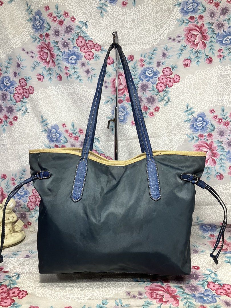 PRADA TESSUTO NYLON TOTE/SHOULDER BAG (Category: Tote Bags) located in General Mariano Alvarez. Submitted by adonid (Listing ID 1469841546, Image 3). Description: PRADA TESSUTO NYLON TOTE/SHOULDER BAG GOOD CONDITION NORMAL SIGN OD USAGE ONLY ISSUE NASA PICTURE NA YUNG SA HANDLE NIYA .