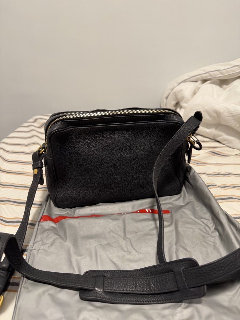 Prada Vitello Phenix Double Zip Crossbody / Camera Bag in Black (Category: Luxury Bags & Wallets) located in Iloilo. Submitted by lorenzoivan (Listing ID 1469760436, Image 3). Description: PRELOVED: Prada Vitello Phenix Double Zip Crossbody / Camera Bag in Black - ₱25,000 SRP: $1,250 / ₱79,000 LEGIT/AUTHENTIC: w/ dustbag in good condition Flaws: little weak structure softened straps old, light signs of usage Asking for ₱25,000 (NEGOTIABLE) Pre-ow