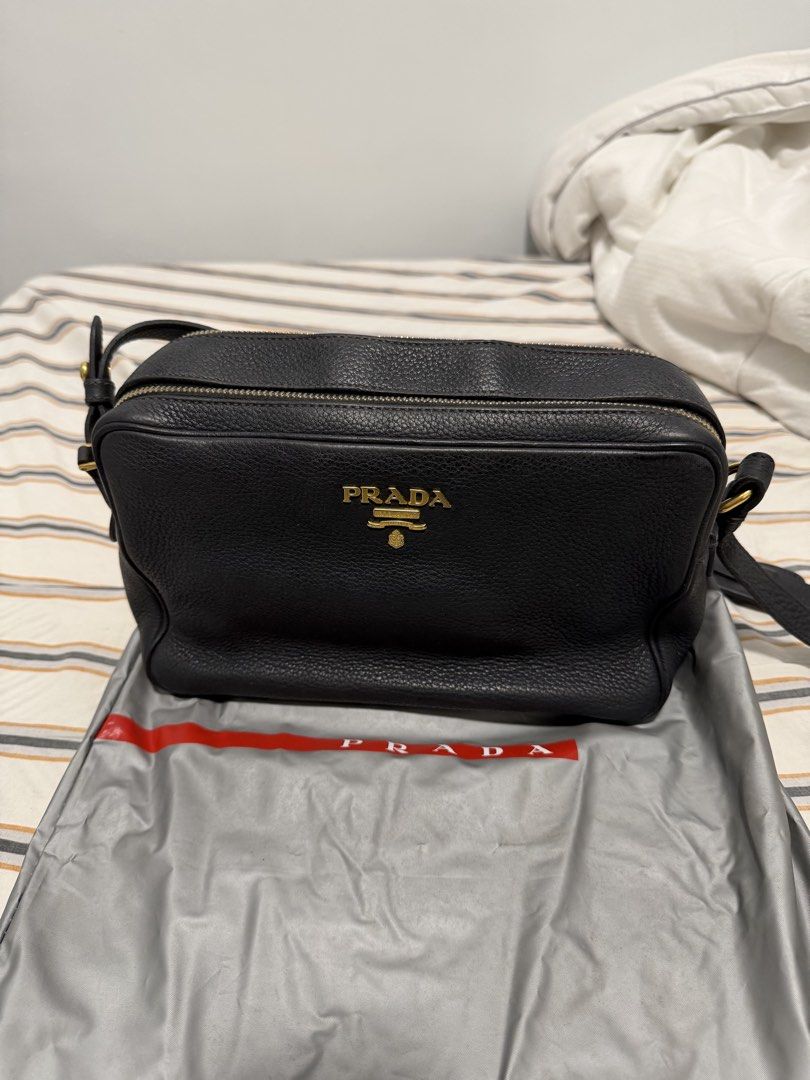 Prada Vitello Phenix Double Zip Crossbody / Camera Bag in Black (Category: Luxury Bags & Wallets) located in Iloilo. Submitted by lorenzoivan (Listing ID 1469760436, Image 2). Description: PRELOVED: Prada Vitello Phenix Double Zip Crossbody / Camera Bag in Black - ₱25,000 SRP: $1,250 / ₱79,000 LEGIT/AUTHENTIC: w/ dustbag in good condition Flaws: little weak structure softened straps old, light signs of usage Asking for ₱25,000 (NEGOTIABLE) Pre-ow