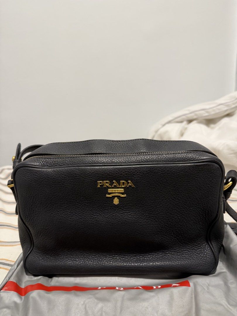 Prada Vitello Phenix Double Zip Crossbody / Camera Bag in Black (Category: Luxury Bags & Wallets) located in Iloilo. Submitted by lorenzoivan (Listing ID 1469760436, Image 1). Description: PRELOVED: Prada Vitello Phenix Double Zip Crossbody / Camera Bag in Black - ₱25,000 SRP: $1,250 / ₱79,000 LEGIT/AUTHENTIC: w/ dustbag in good condition Flaws: little weak structure softened straps old, light signs of usage Asking for ₱25,000 (NEGOTIABLE) Pre-ow