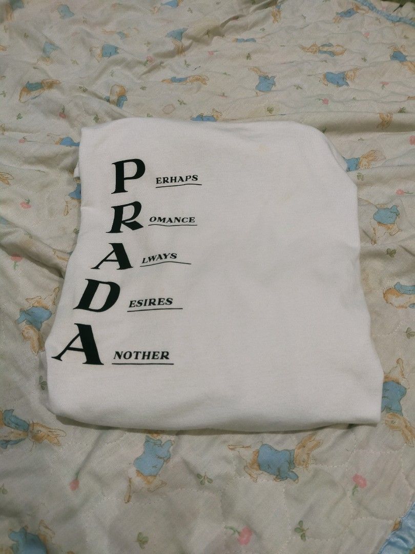 Prada white tee (Category: Formal Shirts) located in Manila. Submitted by kobemodina_0330 (Listing ID 1469875642, Image 2). Description: Prada white tee Size large Verygood condition 650 📥.