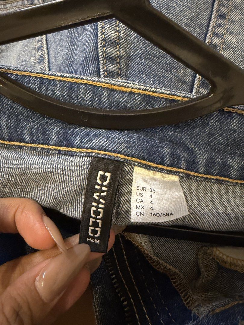 Pre lovedH&M Divided Denim Jeans Size US 4 (Category: Jeans) located in Manila. Submitted by kyelleanne (Listing ID 1469933482, Image 2). Description: - Brand: H&M Divided - Size: EUR 36 / US 4 / CN 160/68A - Style: Classic bootcut / flare with zip fly and button closure - Color/Wash: Medium wash with subtle front fading - Details: Functional front and back pockets with stylish yellow topstitching - Condition: Pre-loved, well-kept.