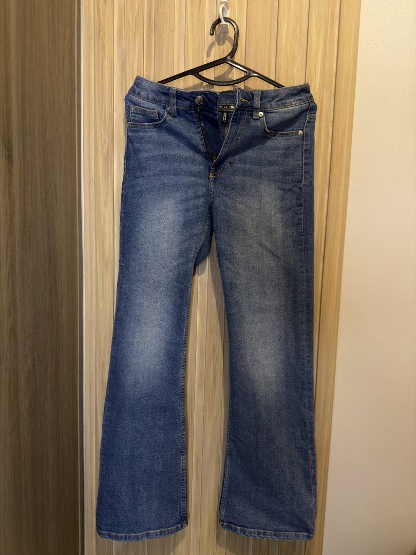 Pre lovedH&M Divided Denim Jeans Size US 4 (Category: Jeans) located in Manila. Submitted by kyelleanne (Listing ID 1469933482, Image 1). Description: - Brand: H&M Divided - Size: EUR 36 / US 4 / CN 160/68A - Style: Classic bootcut / flare with zip fly and button closure - Color/Wash: Medium wash with subtle front fading - Details: Functional front and back pockets with stylish yellow topstitching - Condition: Pre-loved, well-kept.