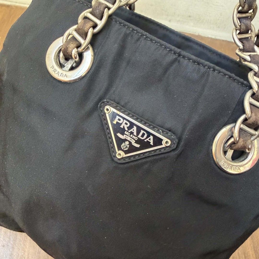 PRE OWNED AUTHENTIC PRADA NYLON VINTAGE CHAIN SHOULDER BAG (Category: Luxury Bags & Wallets) located in Paranaque City. Submitted by Glamfahd (Listing ID 1469879584, Image 3). Description: Pre Owned Authentic PRADA Bag Inclusion/s: None Condition Well Used condition Marks on exterior Marks on interior Bag is really a great buy! Please manage your expectations as you are buying an authentic second hand item at a fraction of the cost.