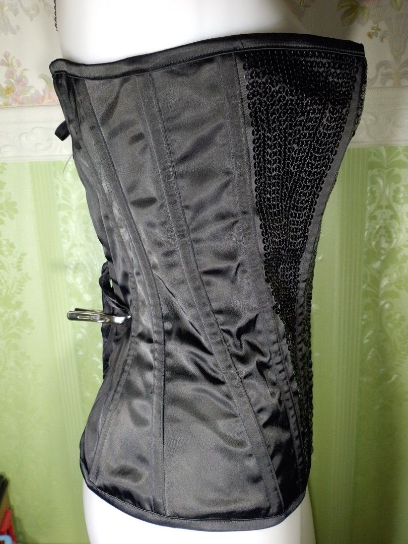 Preloved Ann Summers Black Corset Top (Category: Others Tops) located in Dasmarinas. Submitted by ms.happycorsets (Listing ID 1469901147, Image 3). Description: Preloved Black Corset Top Black Color Can Fit Large size Starting waistline 31-33 inches Starting Bust size 36 inches length 14 1/2 inches Stretchable Fabric Not Padded Has Lace tie Adjustable at the back Has Front Hooks Has 14 Soft bones with Slight flaws Actual Photo Color may Change du