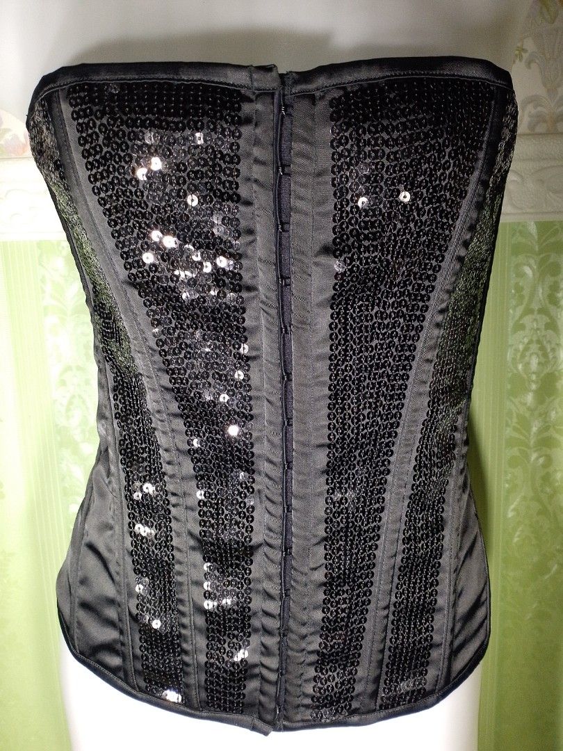 Preloved Ann Summers Black Corset Top (Category: Others Tops) located in Dasmarinas. Submitted by ms.happycorsets (Listing ID 1469901147, Image 2). Description: Preloved Black Corset Top Black Color Can Fit Large size Starting waistline 31-33 inches Starting Bust size 36 inches length 14 1/2 inches Stretchable Fabric Not Padded Has Lace tie Adjustable at the back Has Front Hooks Has 14 Soft bones with Slight flaws Actual Photo Color may Change du