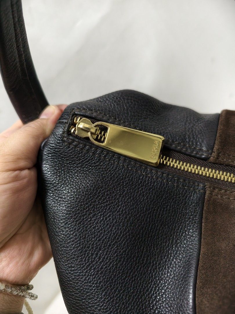 Preloved Furla hobo shoulder bag (Category: Luxury Bags & Wallets) located in Quezon City. Submitted by calmbird.3f2102 (Listing ID 1469892981, Image 3). Description: Preloved furla hobonshoulder bag , Genuine leather & suede stripe combi..
