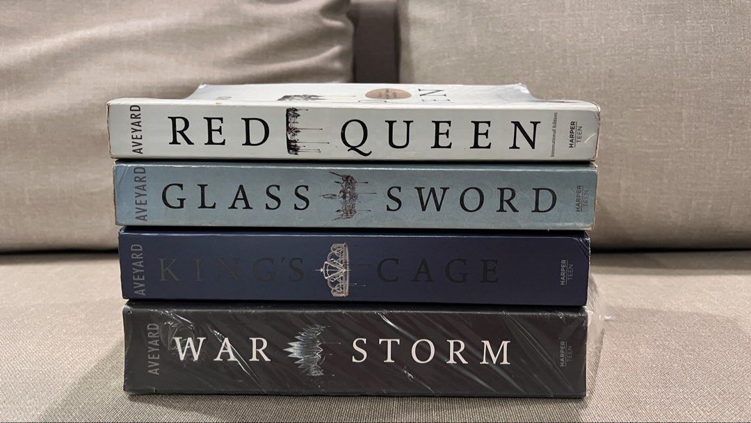 Preloved Red Queen Series by Victoria Aveyard (Category: Storybooks) located in San Fernando. Submitted by declutteringyishi (Listing ID 1469904667, Image 1). Description: open for tingi: red queen - ₱150 glass sword - ₱150 war storm - ₱400 king's cage - ₱400 condition of red queen and glass sword: - name written on the front cover - yellowing and foxing of pages - slight highlights and annotations condition of king's care and war storm: - light 