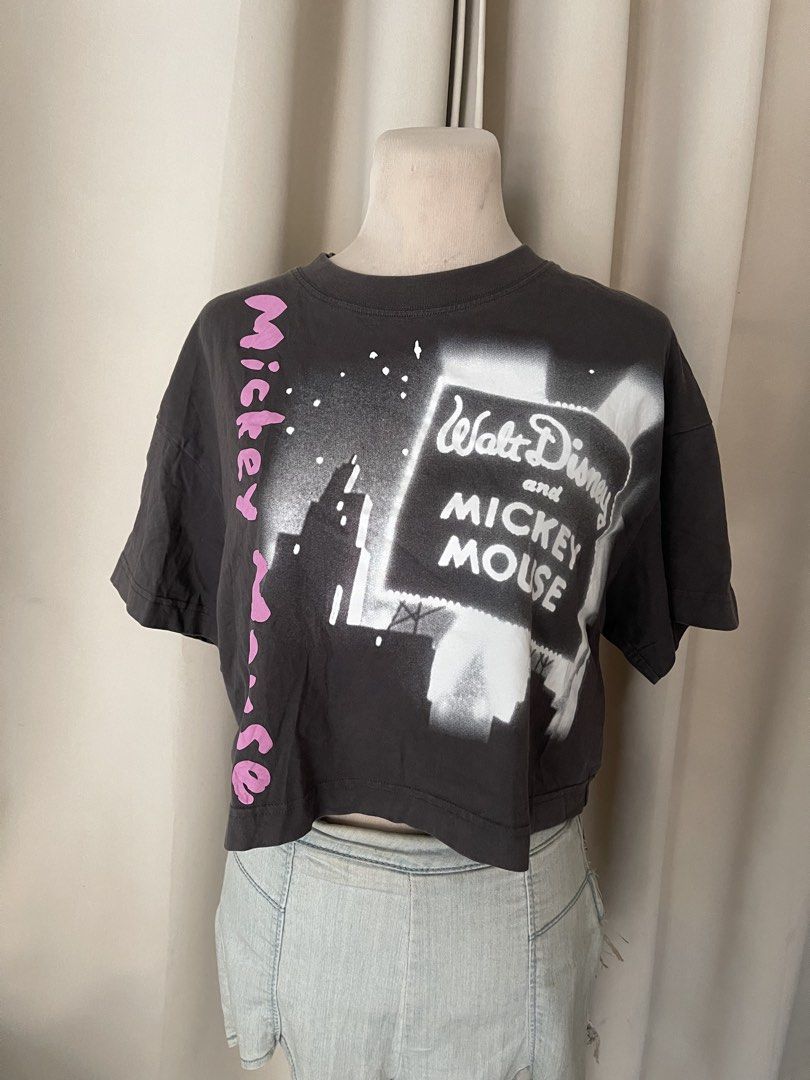 premium Mickey Crop tee (Category: Shirts) located in Cainta. Submitted by zlove111 (Listing ID 1469771744, Image 1). Description: - Charcoal grey cropped Mickey Mouse graphic print - White cityscape design with pink Mickey Mouse lettering along the side - Short sleeves and classic crew neck - Relaxed, trendy boxy fit med-large no issue .