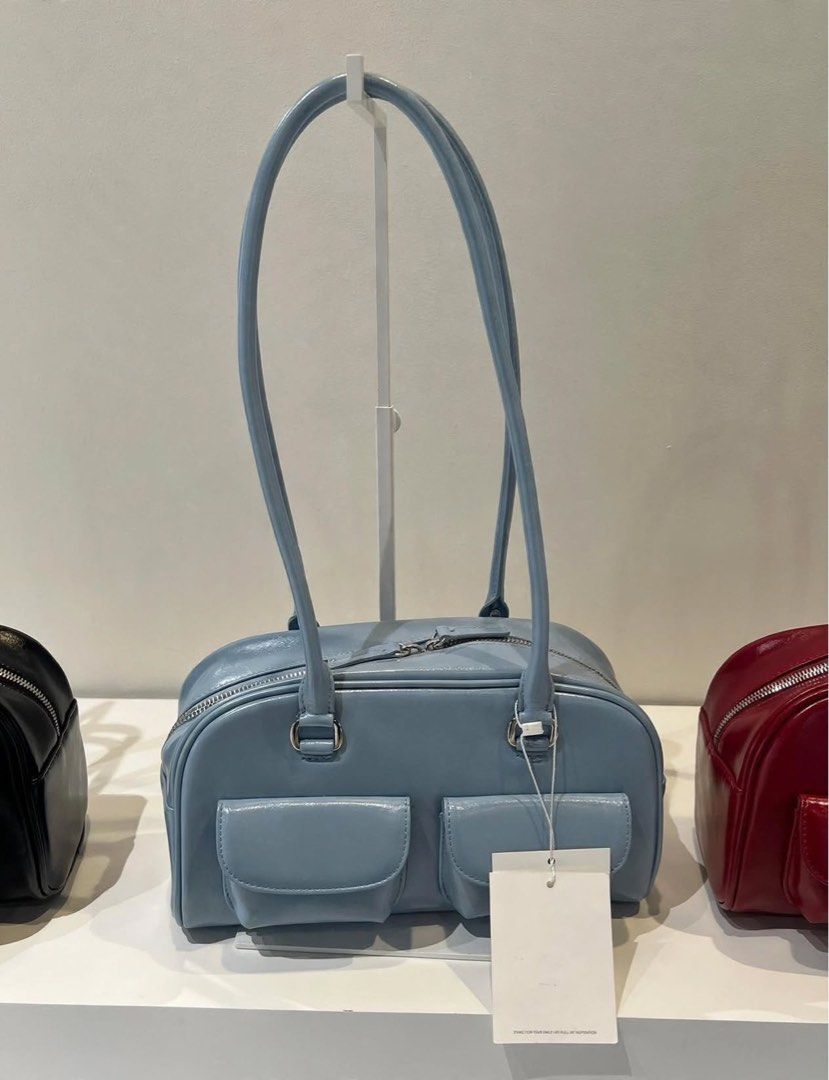 PREORDER Authentic Stand Oil Chubby Bag Sky Blue (Category: Shoulder Bags) located in Manila. Submitted by essential.shop.ph (Listing ID 1469888904, Image 1). Description: PREORDER 10-12 days ETA ☺️ ‘CHUBBY BAG’ – A Round, Chubby Body, Retro Bowling Style Bag - Crinkle faux patent with wrinkles and gloss - Vintage mood handle decoration, soft double-sided zip - Pocket Details: 2 front mini flap pockets, 1 back welt pocket, 2 interior open pockets