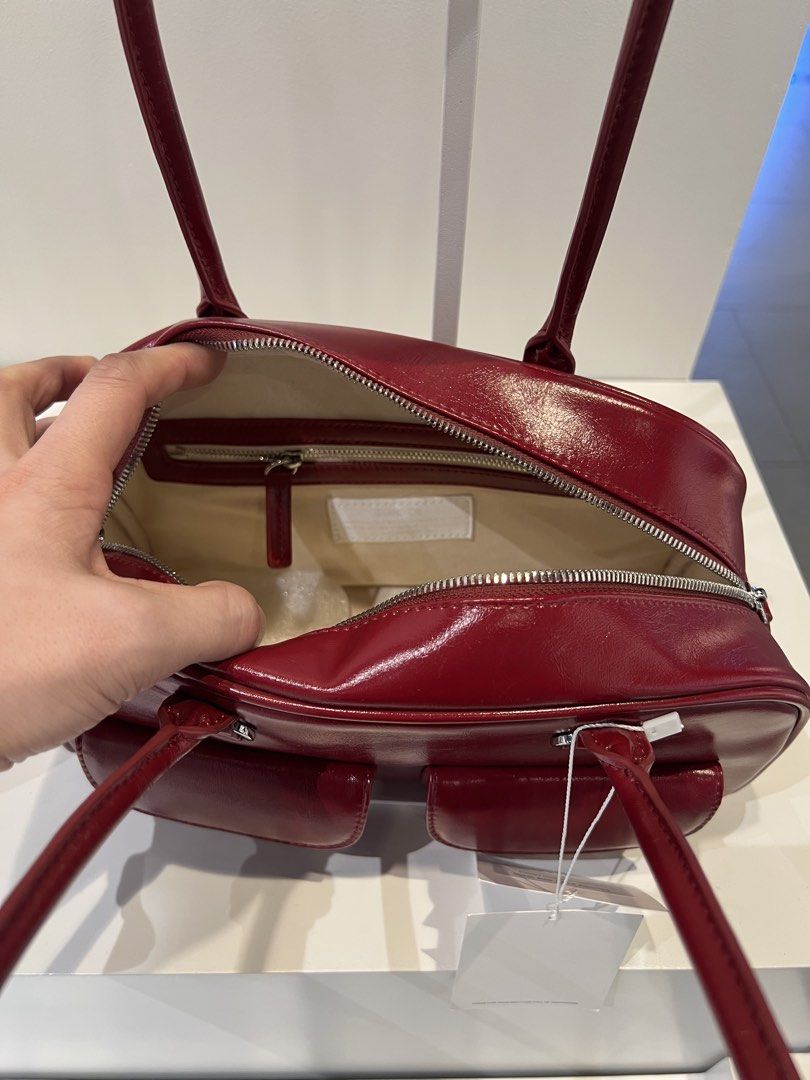 PREORDER Authentic Stand Oil Chubby Bag Red Wine (Category: Shoulder Bags) located in Manila. Submitted by essential.shop.ph (Listing ID 1469889141, Image 3). Description: PREORDER 10-12 days ETA ☺️ ‘CHUBBY BAG’ – A Round, Chubby Body, Retro Bowling Style Bag - Crinkle faux patent with wrinkles and gloss - Vintage mood handle decoration, soft double-sided zip - Pocket Details: 2 front mini flap pockets, 1 back welt pocket, 2 interior open pockets