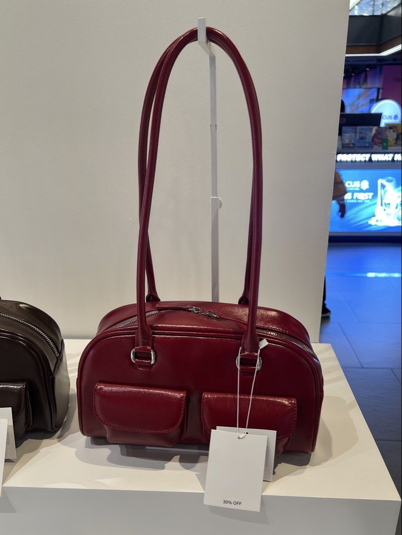 PREORDER Authentic Stand Oil Chubby Bag Red Wine (Category: Shoulder Bags) located in Manila. Submitted by essential.shop.ph (Listing ID 1469889141, Image 1). Description: PREORDER 10-12 days ETA ☺️ ‘CHUBBY BAG’ – A Round, Chubby Body, Retro Bowling Style Bag - Crinkle faux patent with wrinkles and gloss - Vintage mood handle decoration, soft double-sided zip - Pocket Details: 2 front mini flap pockets, 1 back welt pocket, 2 interior open pockets