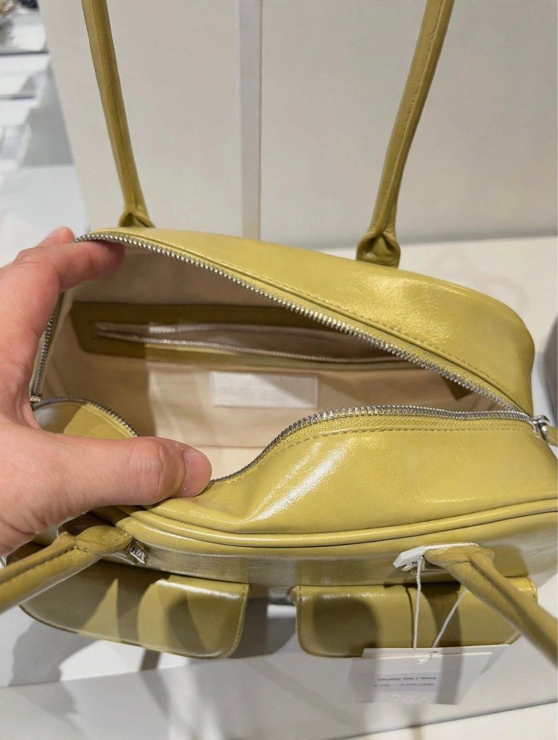 PREORDER Authentic Stand Oil Chubby Bag Lime (Category: Shoulder Bags) located in Manila. Submitted by essential.shop.ph (Listing ID 1469888587, Image 2). Description: PREORDER 10-12 days ETA ☺️ ‘CHUBBY BAG’ – A Round, Chubby Body, Retro Bowling Style Bag - Crinkle faux patent with wrinkles and gloss - Vintage mood handle decoration, soft double-sided zip - Pocket Details: 2 front mini flap pockets, 1 back welt pocket, 2 interior open pockets and
