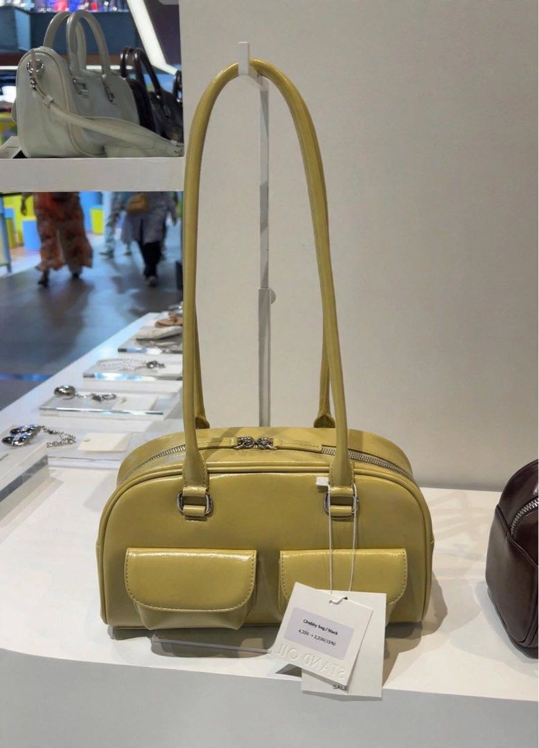 PREORDER Authentic Stand Oil Chubby Bag Lime (Category: Shoulder Bags) located in Manila. Submitted by essential.shop.ph (Listing ID 1469888587, Image 1). Description: PREORDER 10-12 days ETA ☺️ ‘CHUBBY BAG’ – A Round, Chubby Body, Retro Bowling Style Bag - Crinkle faux patent with wrinkles and gloss - Vintage mood handle decoration, soft double-sided zip - Pocket Details: 2 front mini flap pockets, 1 back welt pocket, 2 interior open pockets and