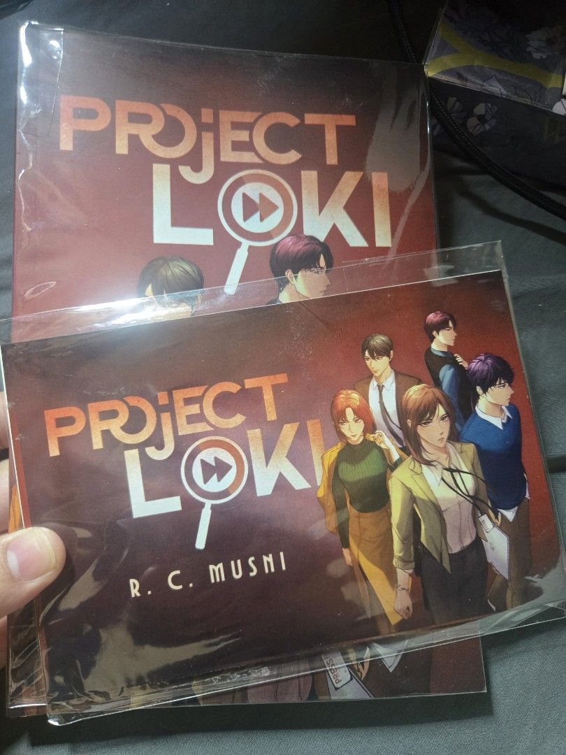 Project Loki (Fire) by R.C. Musni Signed Copy (Category: Storybooks) located in Caloocan City. Submitted by reinabree (Listing ID 1469919936, Image 2). Description: - Title: Project Loki novel by R.C. Musni - Never read -Plastic covered but not taped with comole inclusions of postcards, bookmarks - Condition: Clean inside pages with natural edge yellowing from storage - Special Feature: Signed on the inside page with a personalized quote - Inclus