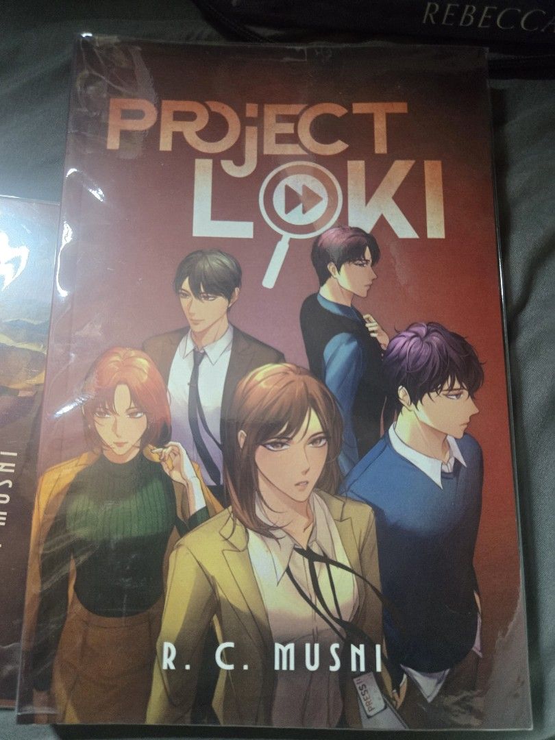 Project Loki (Fire) by R.C. Musni Signed Copy (Category: Storybooks) located in Caloocan City. Submitted by reinabree (Listing ID 1469919936, Image 1). Description: - Title: Project Loki novel by R.C. Musni - Never read -Plastic covered but not taped with comole inclusions of postcards, bookmarks - Condition: Clean inside pages with natural edge yellowing from storage - Special Feature: Signed on the inside page with a personalized quote - Inclus