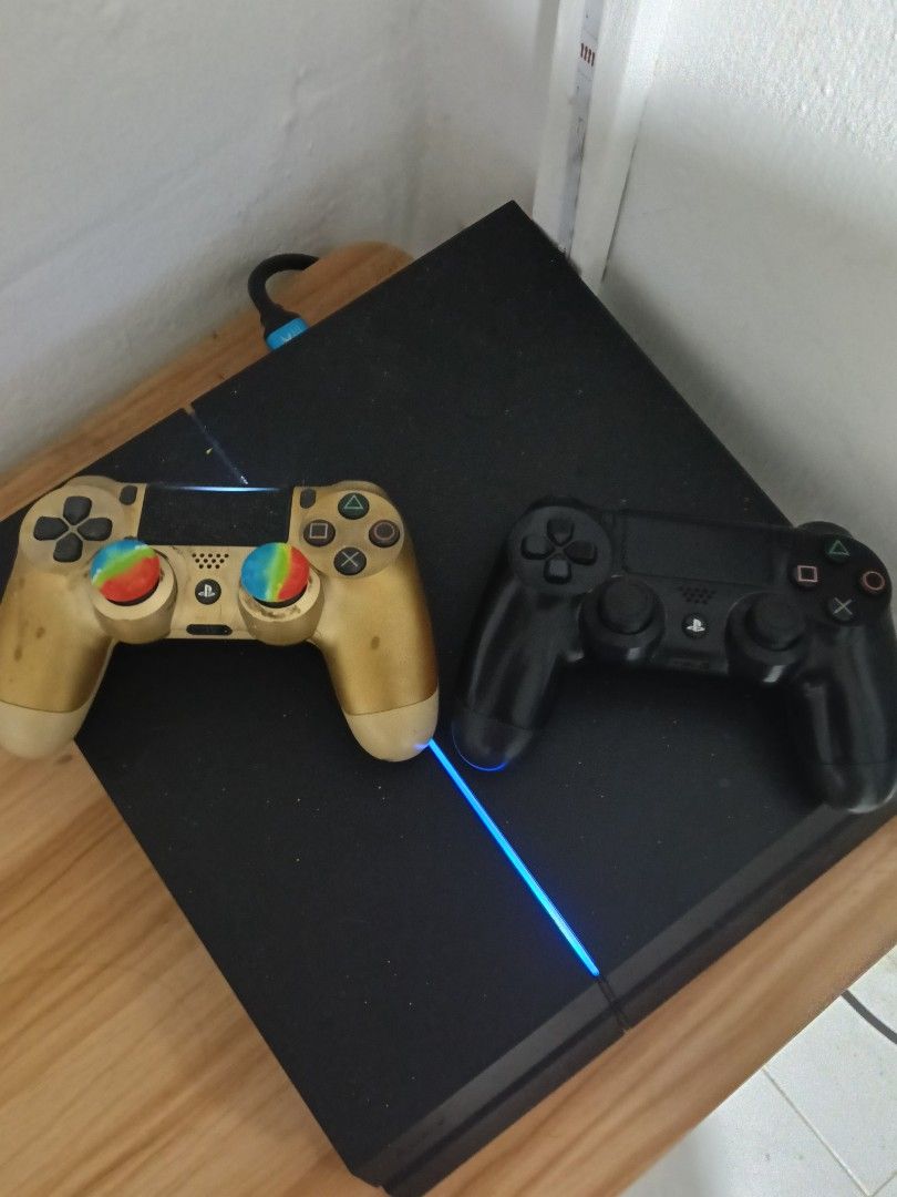 PS4 Console & controller (Category: PlayStation) located in Singapore. Submitted by danial_afan (Listing ID 1469850432, Image 2). Description: Console is in great condition. No issues. The black controller has worn out(stickdrfit) but still able to use. the golden controller has no issues at all but got few stains from paint other then that all is fine. comes with hdmi & the cable. selling for $150 for fast deal but only able to collect on Wednes