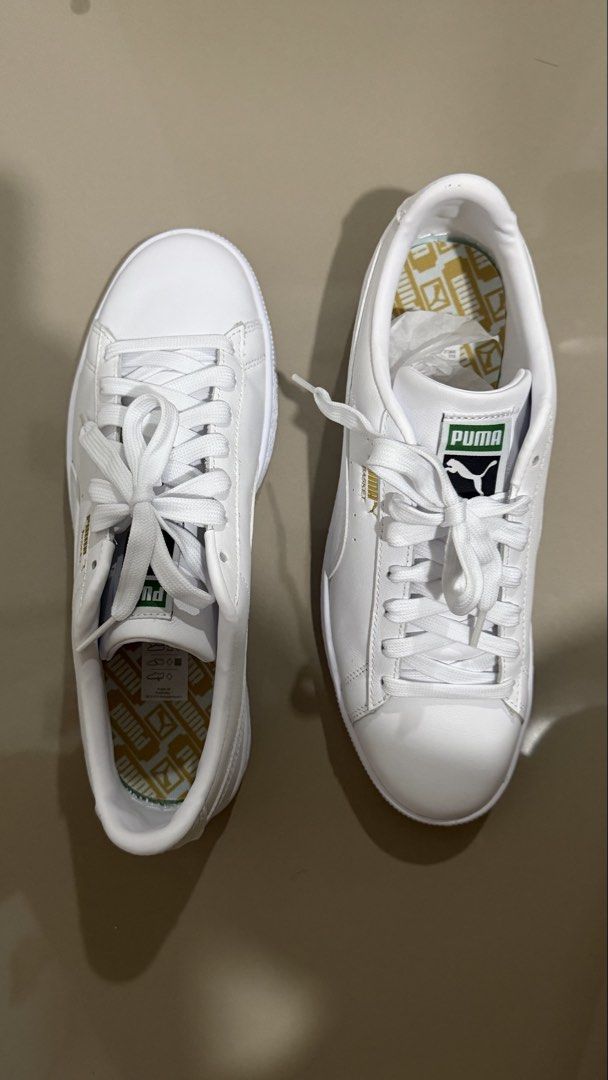 Puma Basket White Leather Sneakers (Category: Sneakers) located in Rizal. Submitted by 20.kph (Listing ID 1469892528, Image 2). Description: - Brand/Model: Puma Basket - Color: White with gold branding - Design: Classic low-top with green and white tongue tag - Features: Patterned insoles, white laces - Inclusion: Original green Puma shoebox - Condition: Clean, crisp, and ready to wear Negotiable for sure buyer!.