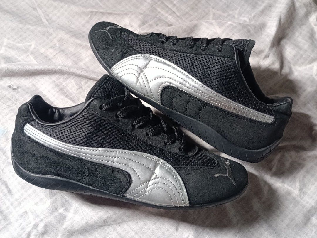 Puma Black and Silver Speedcat Sneakers (Category: Casual Shoes) located in Manila. Submitted by keenforest.c4b4c0 (Listing ID 1469866713, Image 1). Description: - Brand/Model: Black Puma low-profile driving shoes - Design: Sleek sporty style with iconic silver side stripes - Comfort: Breathable mesh panels and classic black laces - Durability: Sturdy rubber soles for daily wear - Details: Signature Puma logo on the toe and tongue area - Conditio